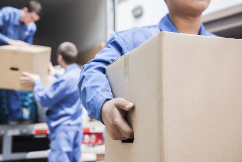 Professional small removals team handling furniture in Petersham