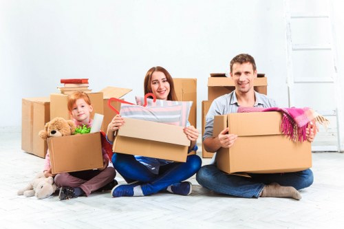 Professional removals team handling boxes in Petersham