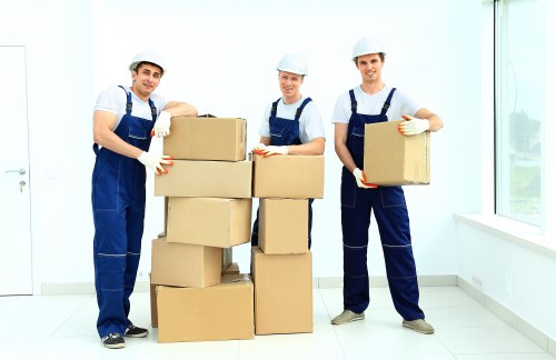 Packed moving boxes and labelled household items ready for removals